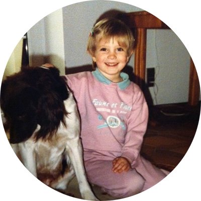 Katharina Miklauz as a child with the family dog at the time